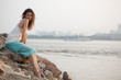woman sitting near water