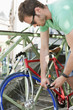 Photo: Man locking his bicycle, Paris, Ile-de-France, France Man locking his bicycle, Paris, Ile-de-France, France
