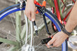 Photo: Close-up of a man's hands locking his bicycle, Paris, Ile-de-France, France Close-up of a man's hands locking his bicycle, Paris, Ile-de-France, France