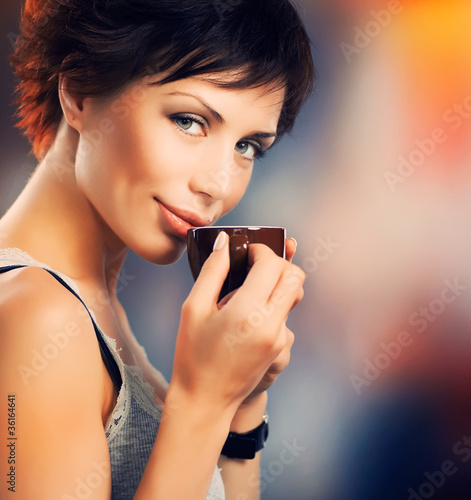 Photo: Beautiful Girl With Cup of Coffee Beautiful Girl With Cup of Coffee