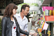 Couple shopping at a market stall, Paris, Ile-de-France, France