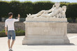 Photo: Man taking a picture of a sculpture in a garden, Jardin des Tuileries, Paris, Ile-de-France, France Man taking a picture of a sculpture in a garden, Jardin des Tuileries, Paris, Ile-de-France, France