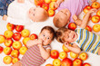Group lying in apples