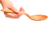 Hand holding wooden spoon