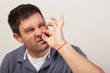 Man painfully picking his nose hair Man painfully picking his nose hair