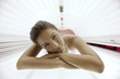 Beautiful young woman tanning in solarium Beautiful young woman tanning in solarium