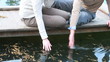 Video: Young couple sitting on pier and kissing Young couple sitting on pier and kissing