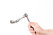 hand with wrench