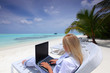 tropical business woman with laptop