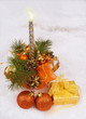 Photo: Christmas silver candles and golden box and spheres on white fur Christmas silver candles and golden box and spheres on white fur