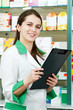 Pharmacy chemist woman in drugstore