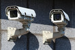 Photo: two white security CCTV cameras on the wall two white security CCTV cameras on the wall