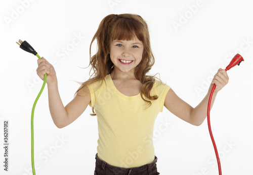 Photo: Little Girl Holding Power Cords Little Girl Holding Power Cords