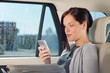 Executive woman manager sitting in car calling