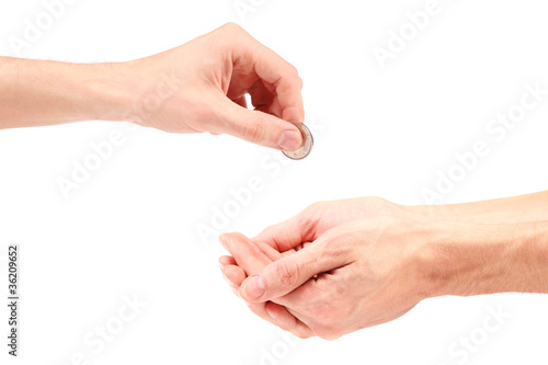 Photo: hand gives coin to beggar hand gives coin to beggar