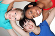 Photo: Happy group huddle by mixed race student girls Happy group huddle by mixed race student girls