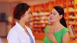 Woman explaining symptons to pharmacist