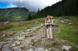 Backpacker girl exploring the mountains.