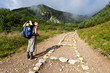 Backpacker girl exploring the mountains.
