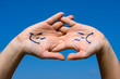 Photo: Palm in the sky with a smile and sorrow pattern Palm in the sky with a smile and sorrow pattern