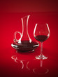 glass of red wine and pitcher glass of red wine and pitcher