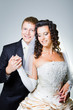 just married groom and  bride on gray
