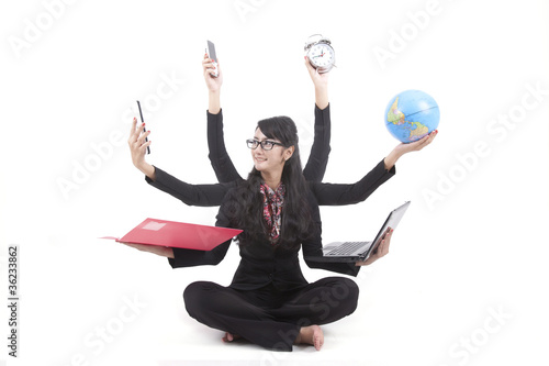 Foto: Multi-tasking Business Woman isolated on white Multi-tasking Business Woman isolated on white