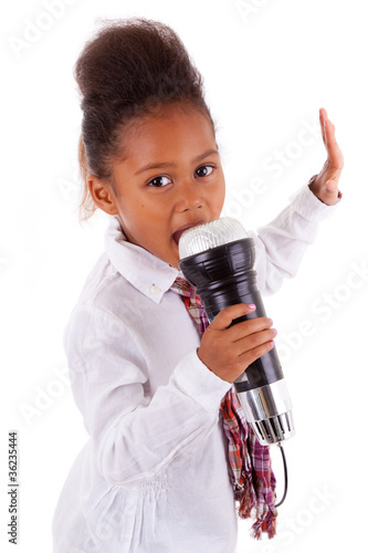 Photo: Cute little African Asian girl singing Cute little African Asian girl singing