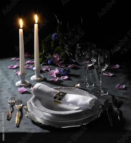 Photo: festive place setting and candlelight festive place setting and candlelight