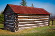 Very Small, Old Log Cabin with Rusted Tin Roof