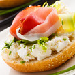 Breadroll with cream cheese and smoked bacon