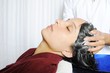 Lady having hair treatment in a hair salon.