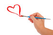 Hand draws a red heart on a white background