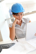Smiling woman architect in office working with electronic tablet Smiling woman architect in office working with electronic tablet