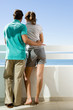 Couple standing on a balcony Couple standing on a balcony