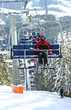 Photo: Skiers in chairlift Skiers in chairlift