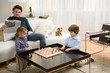 Brother and sister playing chess Brother and sister playing chess