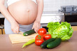 Pregnancy and nutrition - pregnant woman with vegetables Pregnancy and nutrition - pregnant woman with vegetables