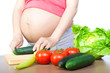Pregnancy and nutrition - pregnant woman with vegetables Pregnancy and nutrition - pregnant woman with vegetables