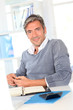 Man sitting in office in front of laptop computer