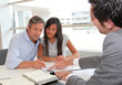 Father and girl signing loan contract