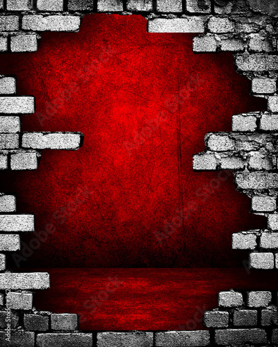 Photo: broken brick wall with red interior broken brick wall with red interior