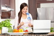 Photo: Cooking woman using computer Cooking woman using computer