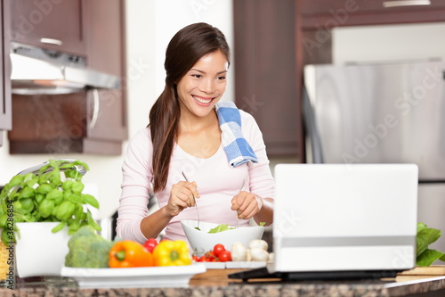 Photo: Cooking woman using computer Cooking woman using computer