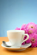 Photo: cup and a bouquet of beautiful flowers cup and a bouquet of beautiful flowers