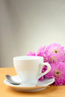 Photo: cup and a bouquet of beautiful flowers cup and a bouquet of beautiful flowers