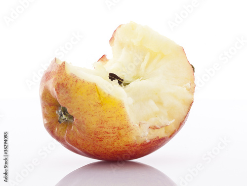 Photo: Half eaten apple on white background Half eaten apple on white background