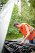 Young female driver wearing a high visibility vest