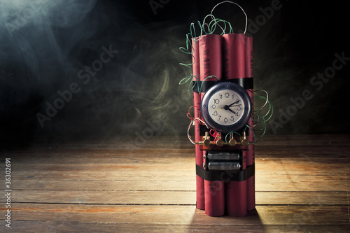 Photo: Dynamite time bomb on a black background Dynamite time bomb on a black background