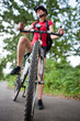 pretty young female biker outddors on her mountain bike